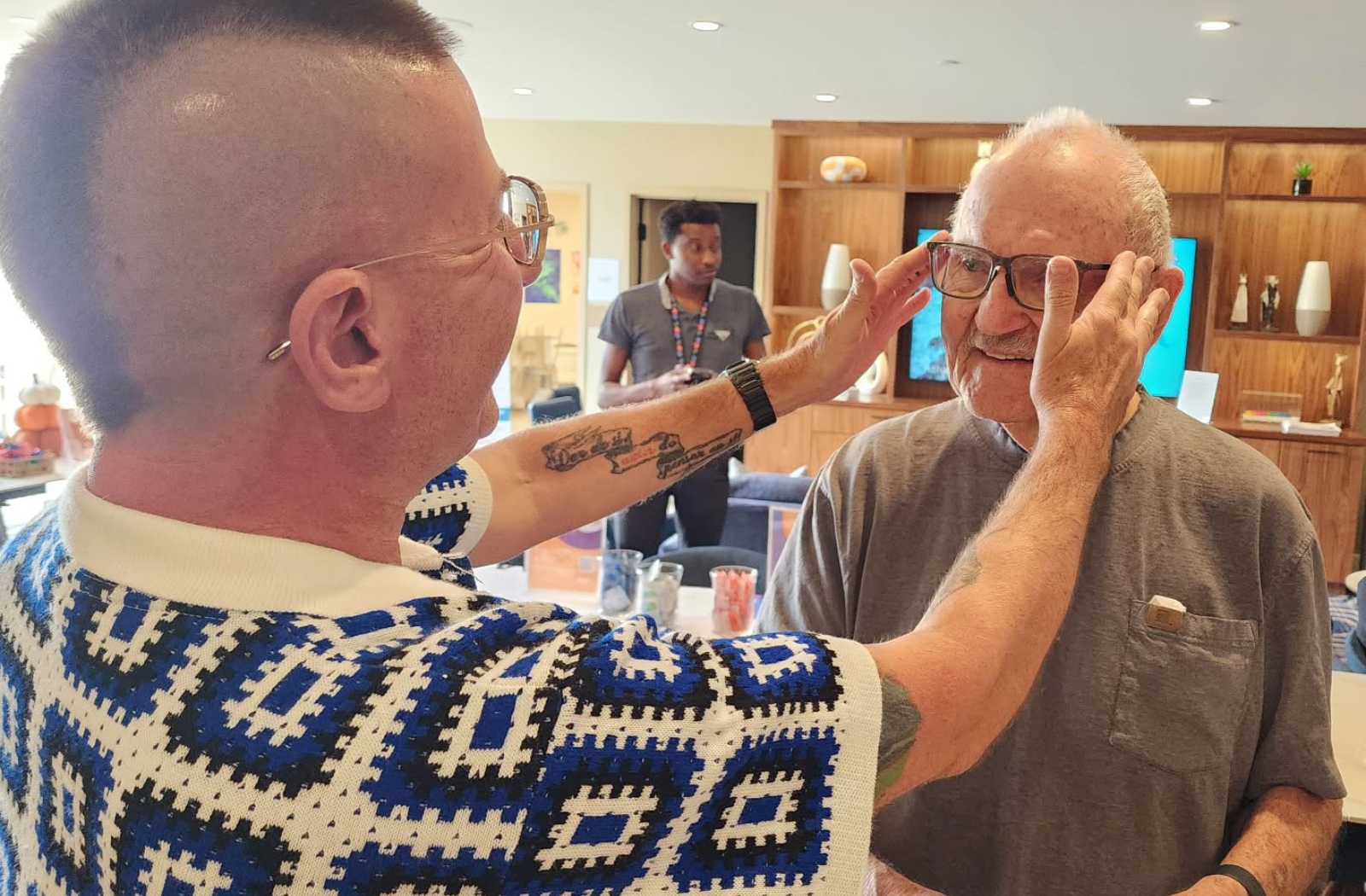 Optician and patient in a 1-on-1 styling appointment to find a new pair of glasses frames.
